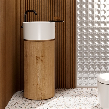 Core I - Runt vitt tvättställ som svävar på väggen.